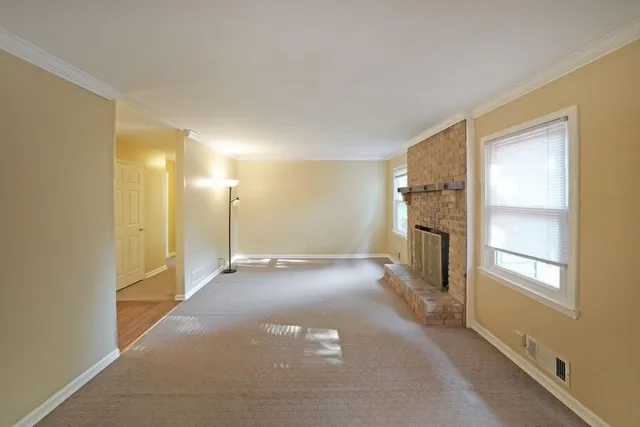 a view of a hallway with wooden shelves