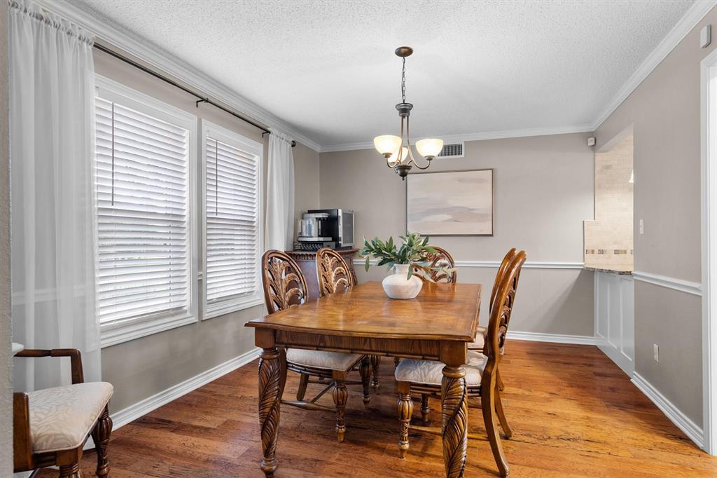 410 Simmons Road Double Oak, TX 75077 - Photo 12 of 40 Dining area bathed in natural light.