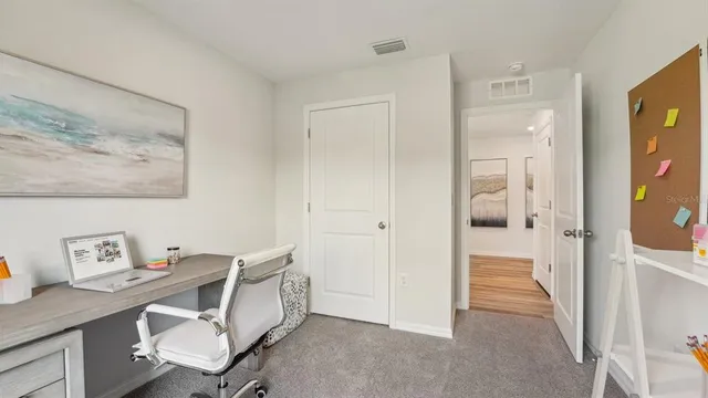 a view of a hallway with workspace