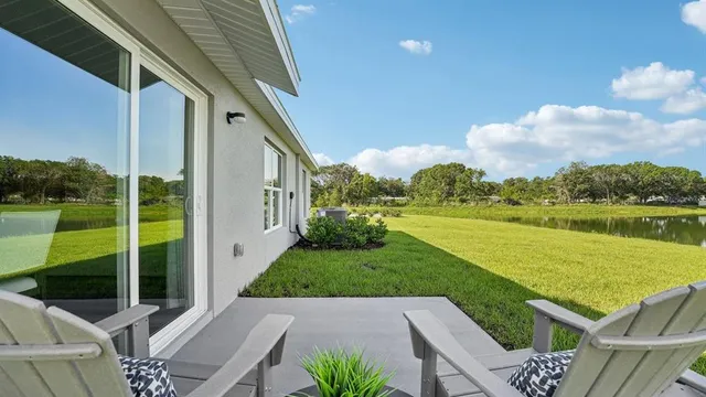a view of a patio with a table chairs and a table