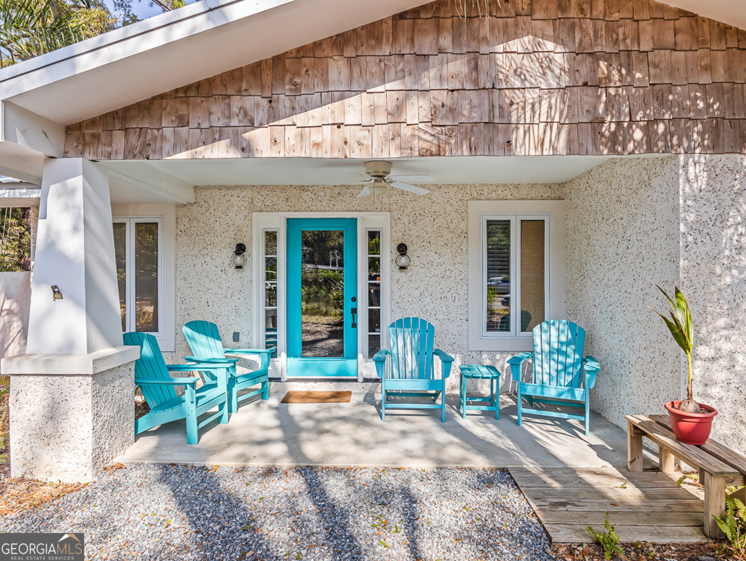 103 Cater Street St. Simons, GA 31522 - Photo 2 of 30 a view of a chair and table in the patio