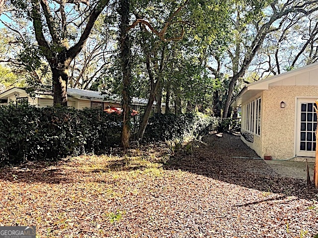 103 Cater Street St. Simons, GA 31522 - Photo 30 of 30 a view of a yard covered in snow