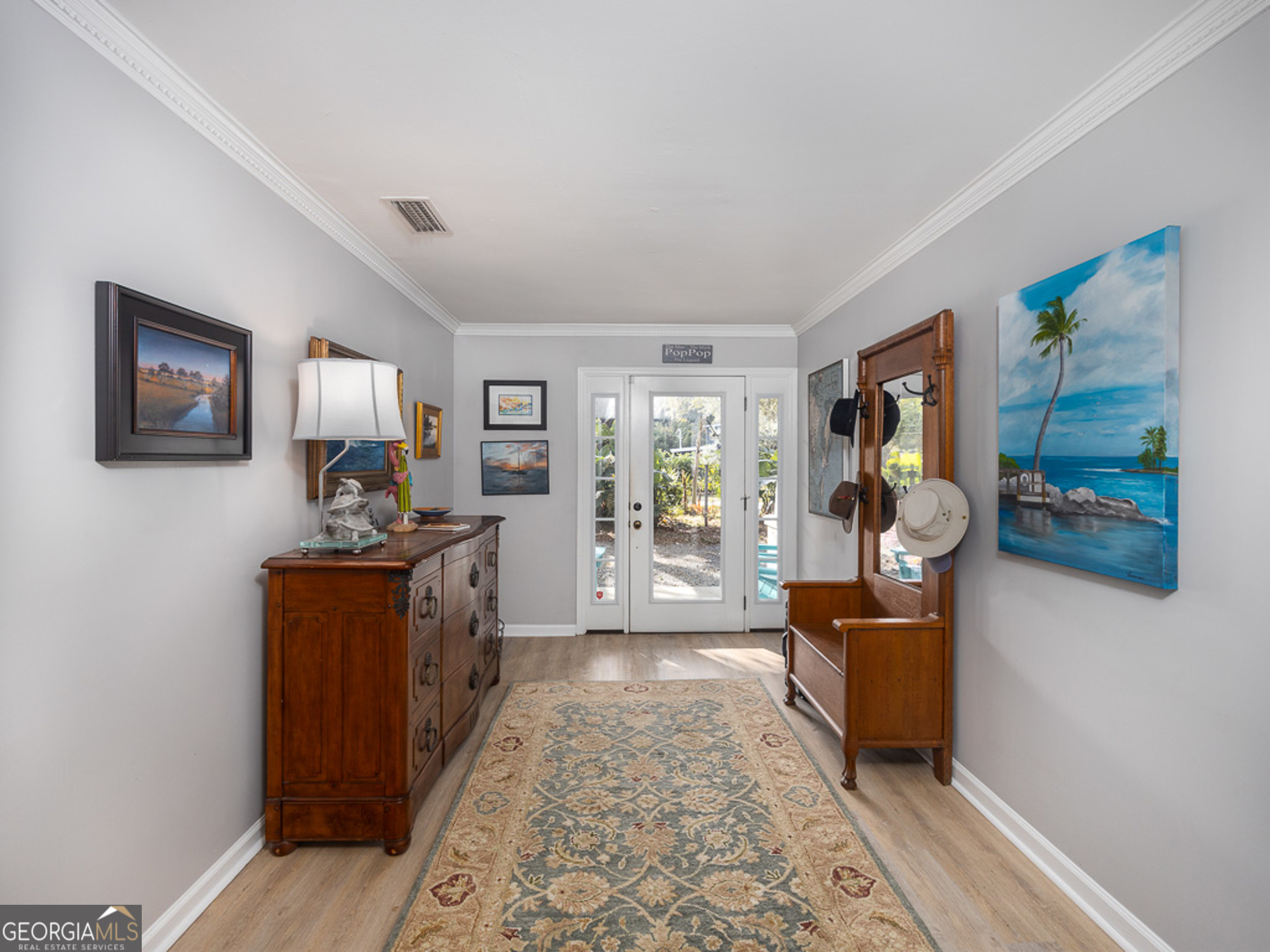 103 Cater Street St. Simons, GA 31522 - Photo 5 of 30 a living room with furniture and a flat screen tv