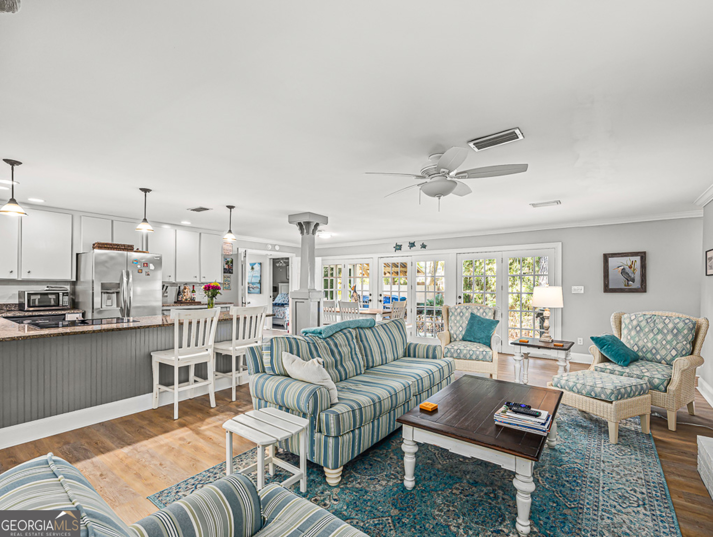 103 Cater Street St. Simons, GA 31522 - Photo 6 of 30 a living room with furniture and a large window
