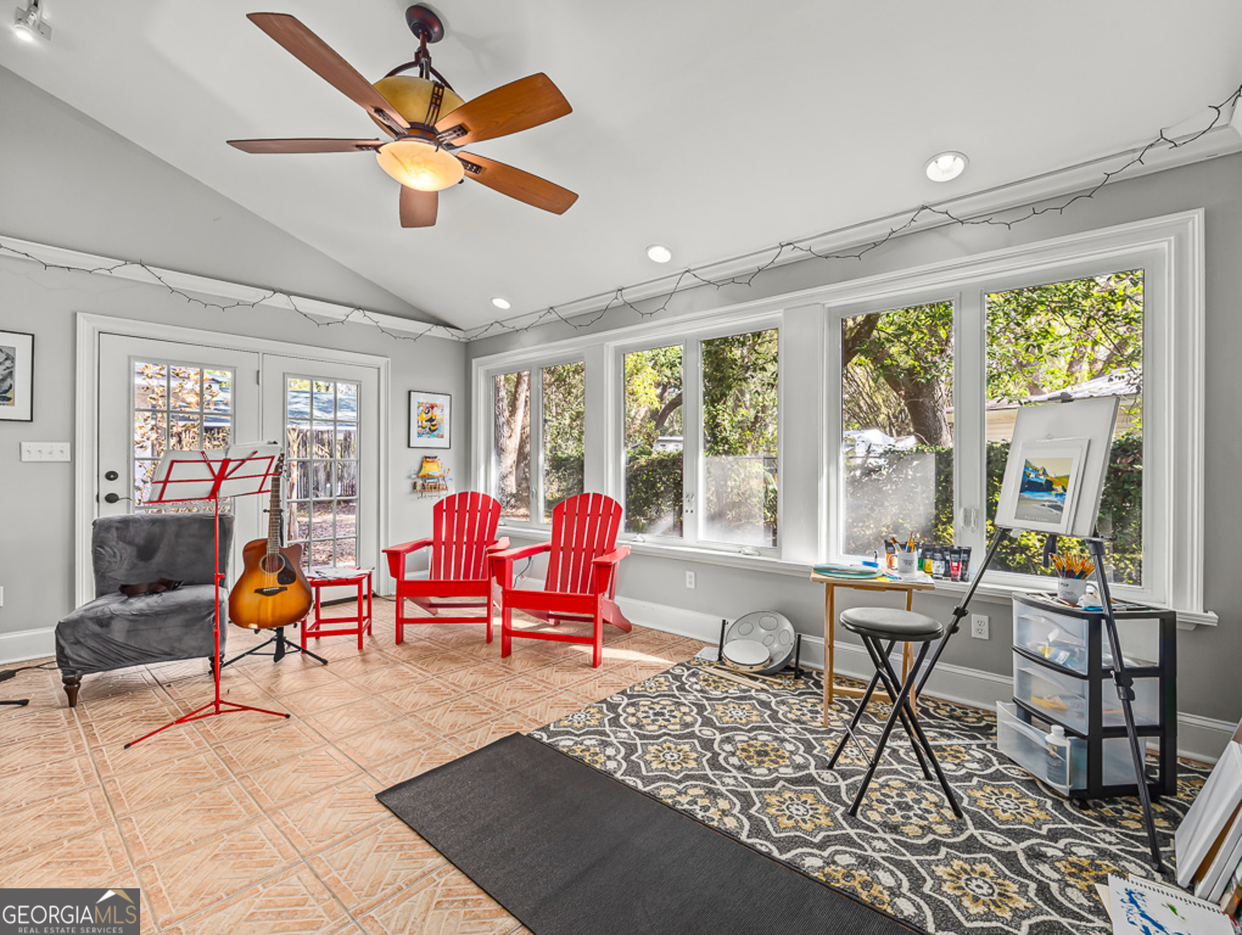 103 Cater Street St. Simons, GA 31522 - Photo 9 of 30 a living room with furniture a rug and a large window
