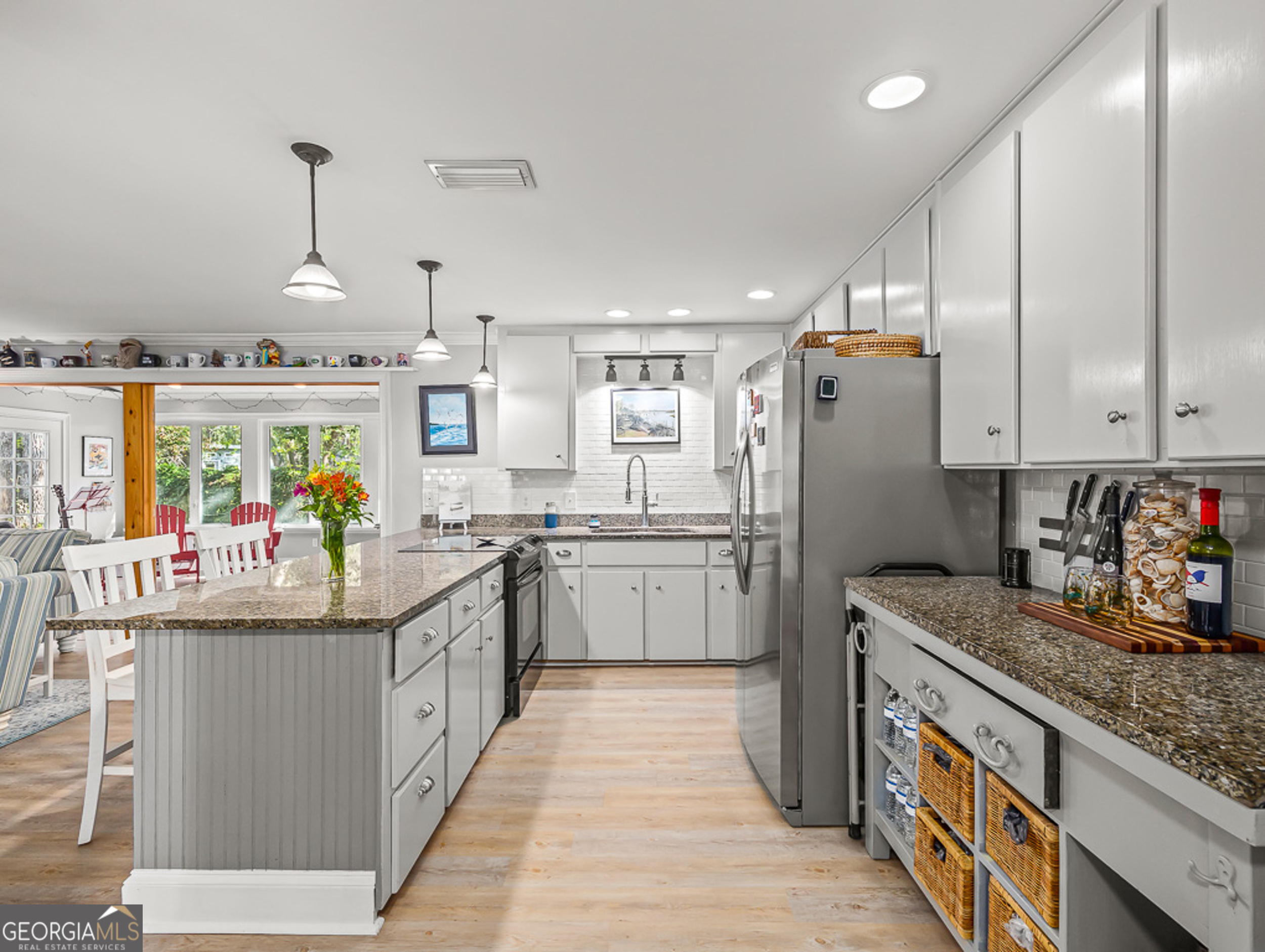 103 Cater Street St. Simons, GA 31522 - Photo 10 of 30 a kitchen with stainless steel appliances granite countertop a sink and dishwasher