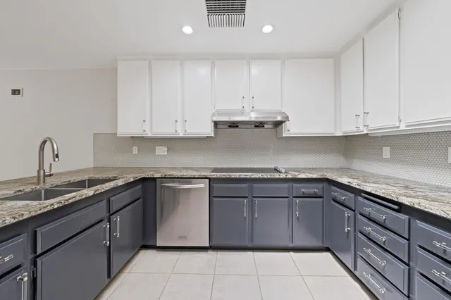 a kitchen with a refrigerator stove and microwave