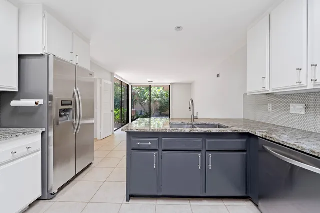 a view of an empty room with a large window