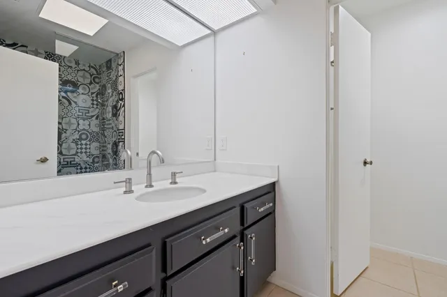 a bathroom with a bathtub and shower