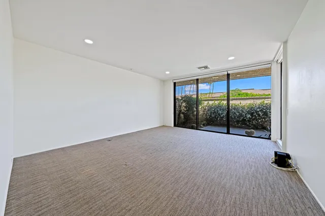 a bathroom with a double vanity sink and a bathtub