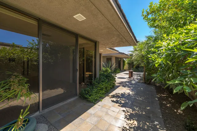 a view of a door and a pathway of a house