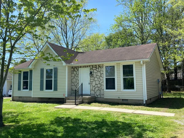 front view of a house with a yard