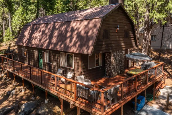 a backyard of a house with wooden stairs