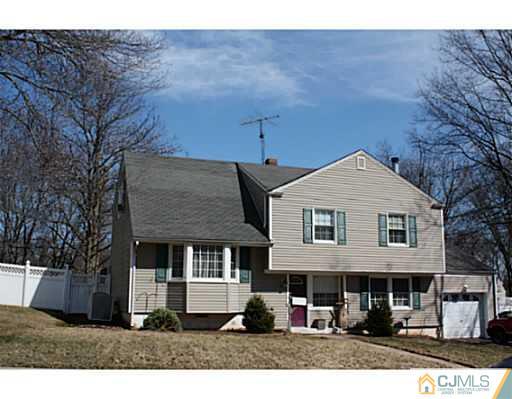 31 Phillips Road Edison, NJ 08817 - Photo 1 of 4 a front view of a house with a garden