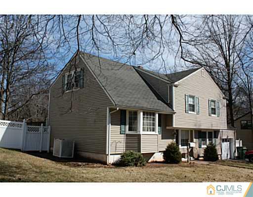 31 Phillips Road Edison, NJ 08817 - Photo 2 of 4 a front view of a house with a yard