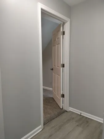 an empty room with wooden floor