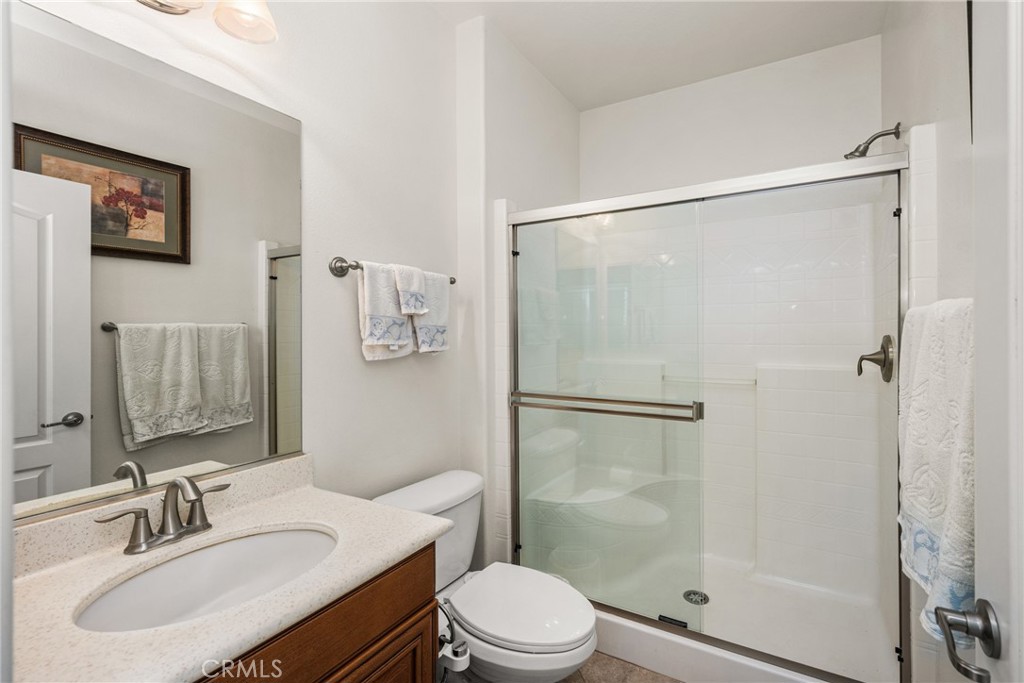 12652 Twin Peak Court Riverside, CA 92503 - Photo 20 of 55 a bathroom with a sink toilet and shower