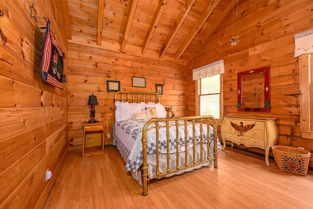 a living room with fireplace furniture and a flat screen tv