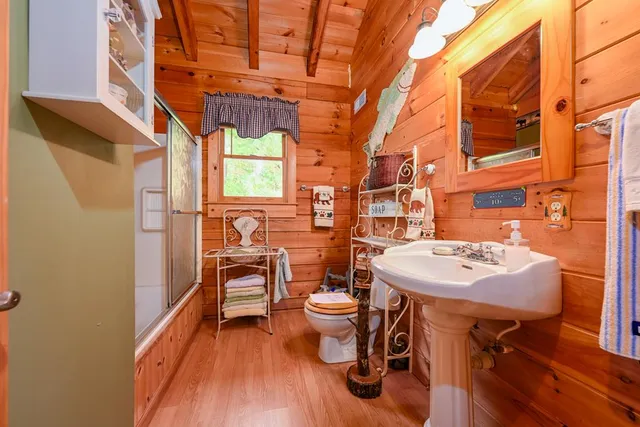 a room with pool table and windows