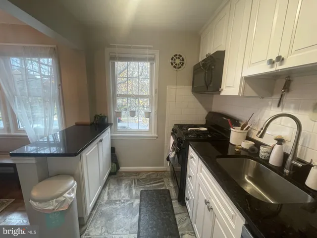 a bedroom with a bed and a cabinets