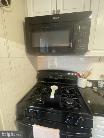 a bedroom with a bed and a table in it