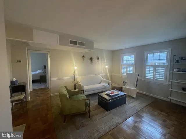 a view of a dining room with furniture and window