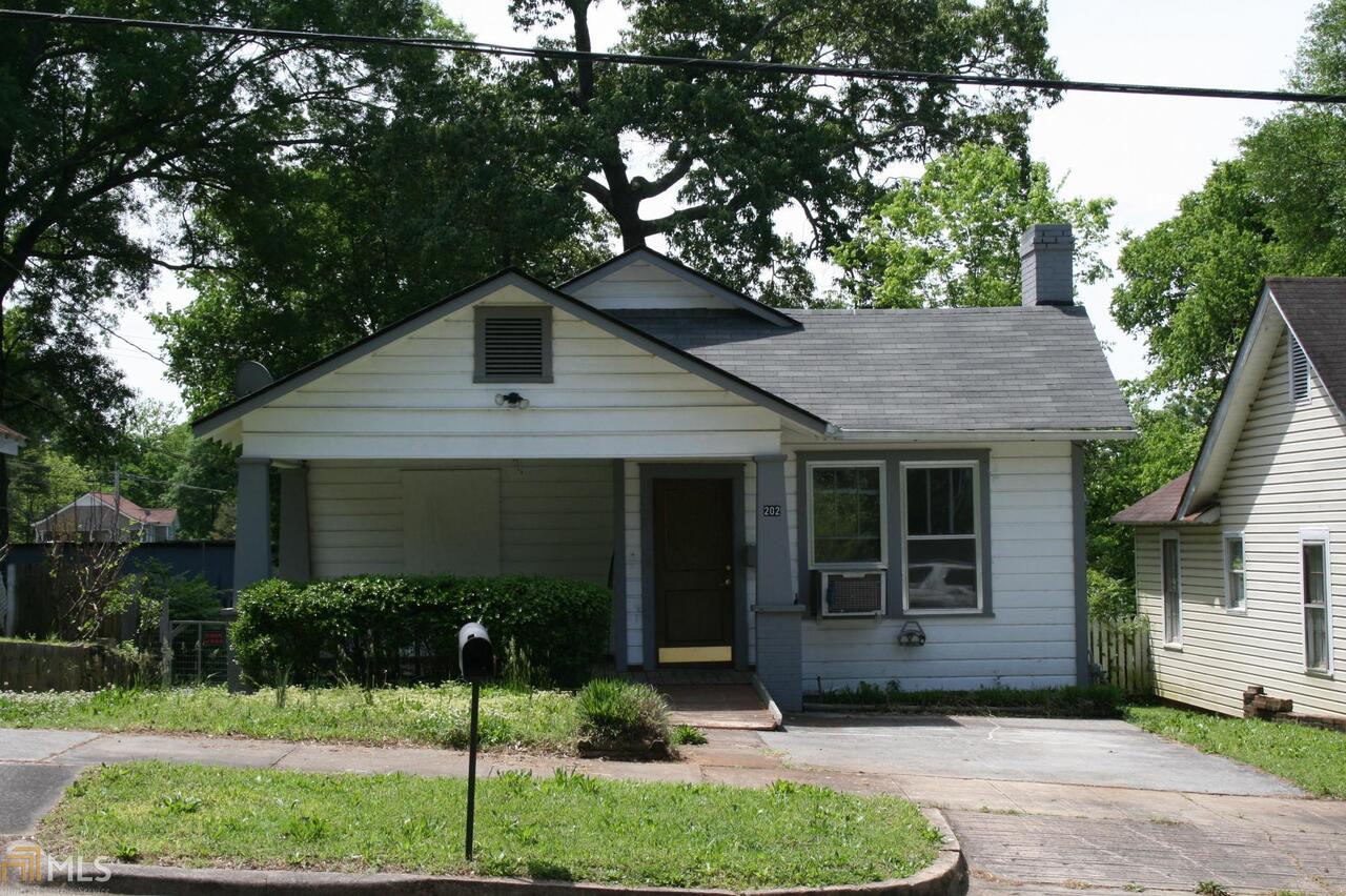 202 East 10th Street Rome, GA 30161 - Photo 1 of 1 a front view of a house with a yard