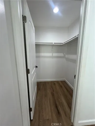 a view of a room with wooden floor and staircase