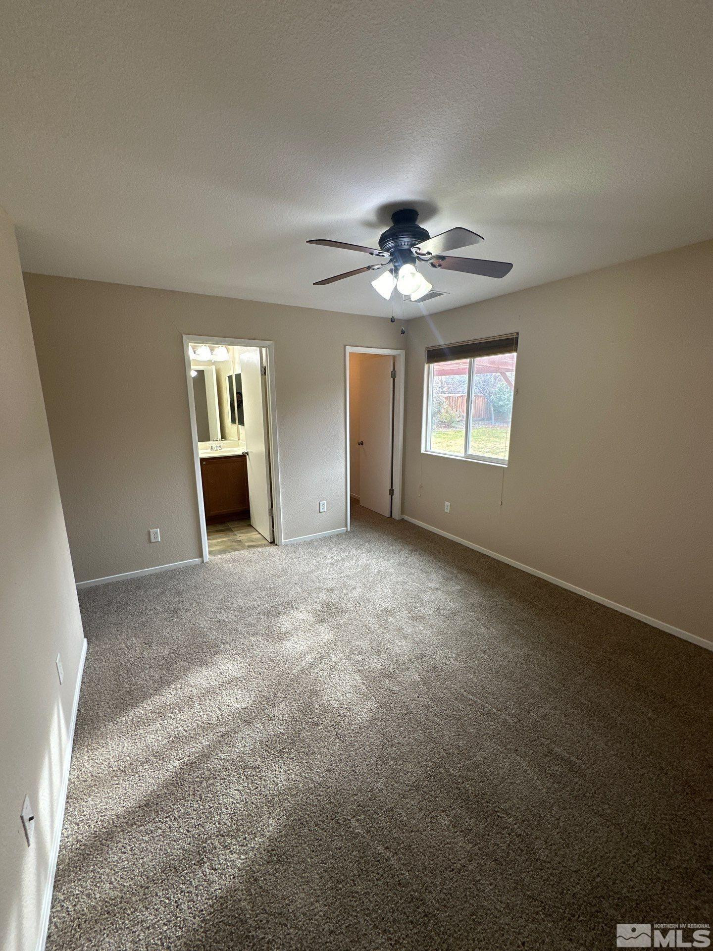 470 Manciano Way Reno, NV 89521 - Photo 12 of 22 a view of an empty room with a window