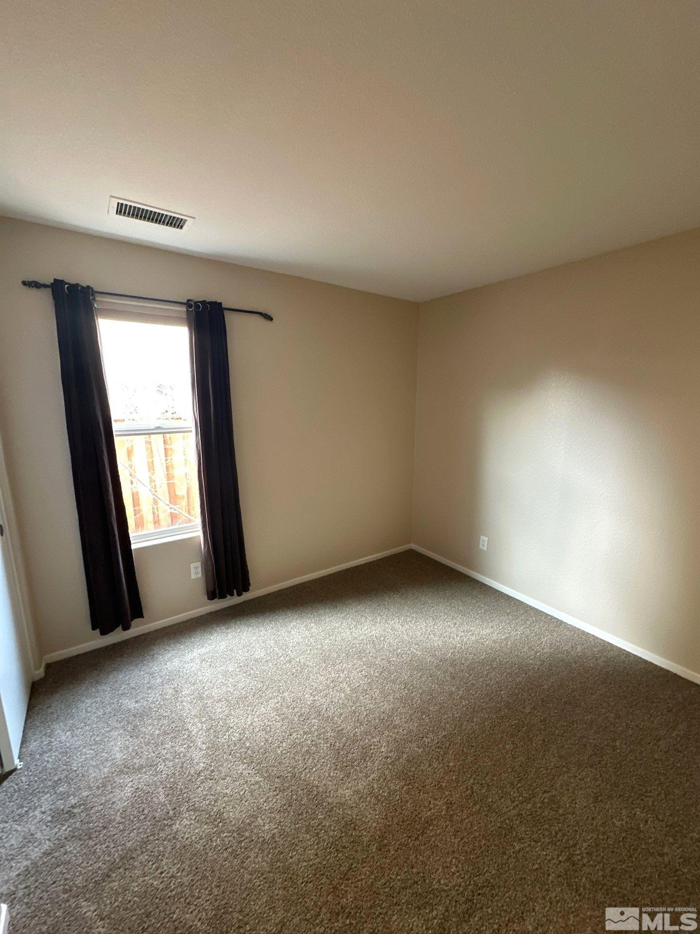 470 Manciano Way Reno, NV 89521 - Photo 14 of 22 an empty room with a window