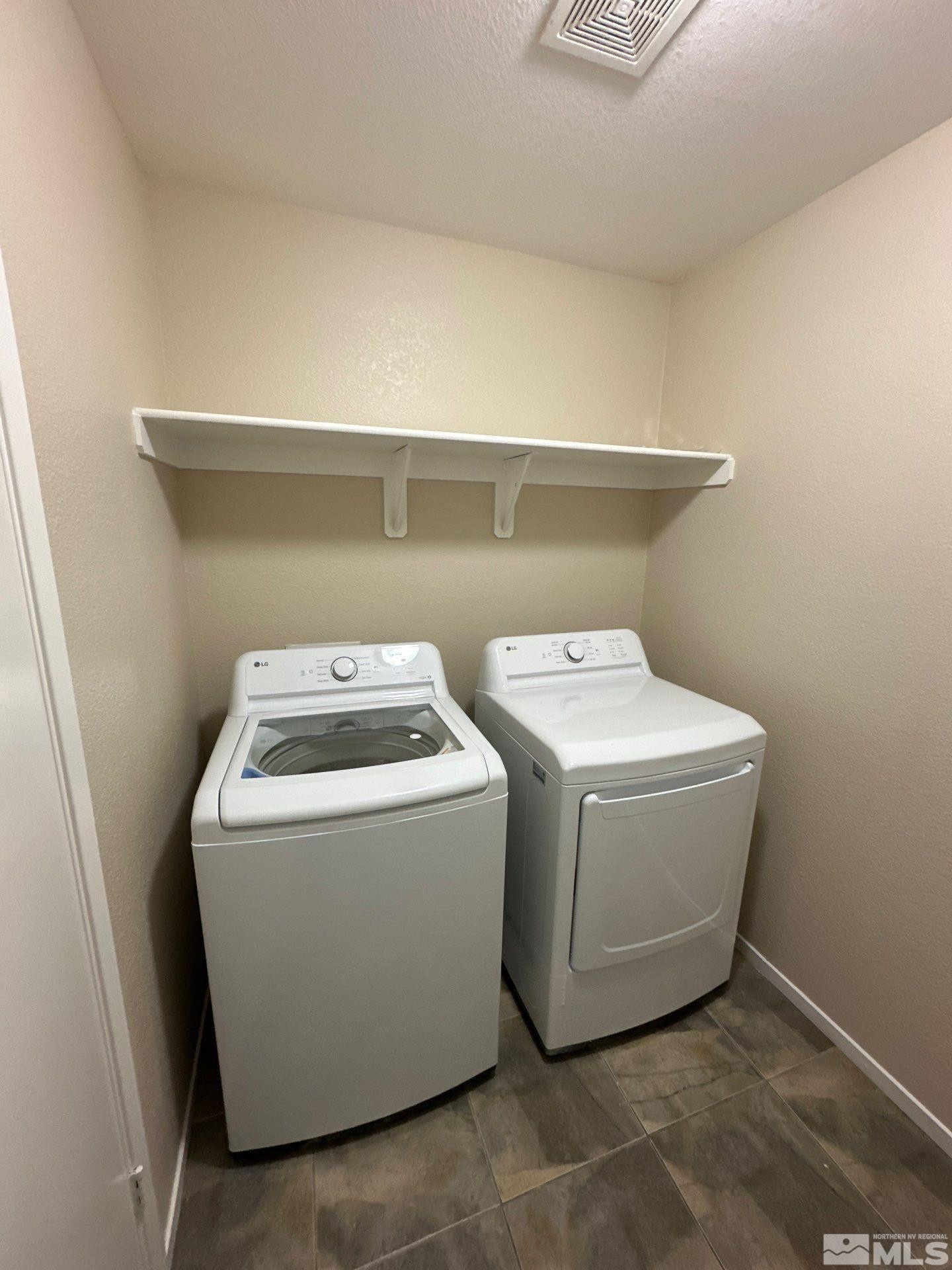 470 Manciano Way Reno, NV 89521 - Photo 19 of 22 a utility room with dryer and washer