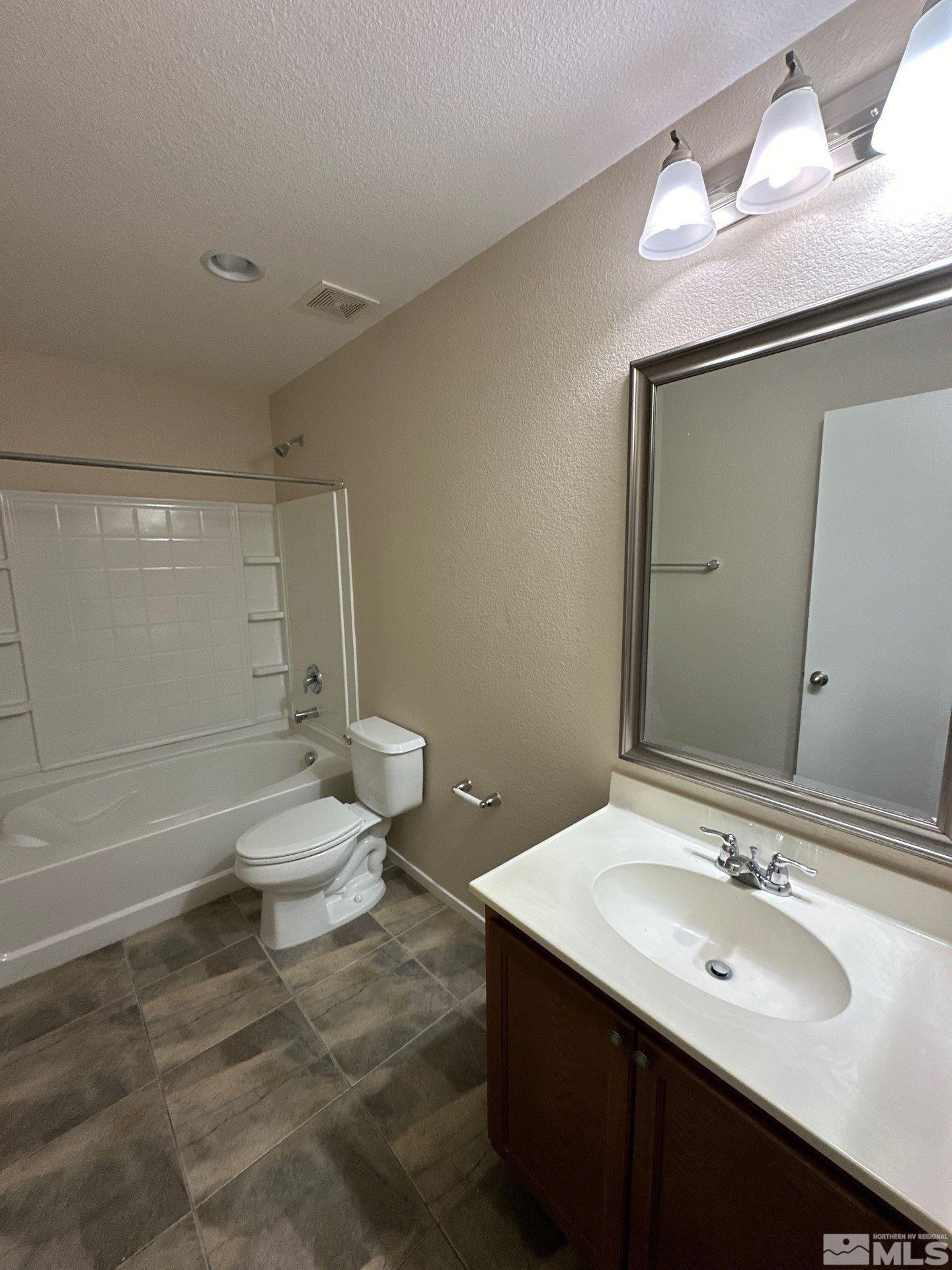 470 Manciano Way Reno, NV 89521 - Photo 10 of 22 a bathroom with a sink a toilet and shower