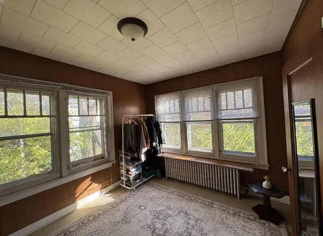 a view of a room with furniture floor to ceiling windows