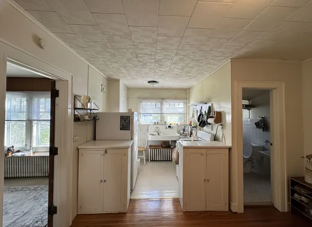 a view of a kitchen and dining room