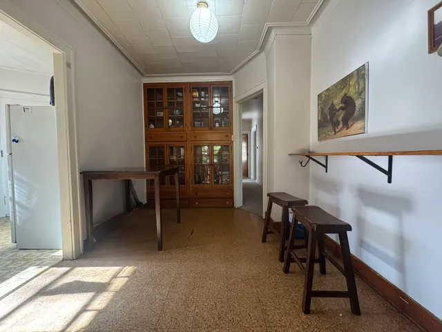 a view of a livingroom with furniture and a window