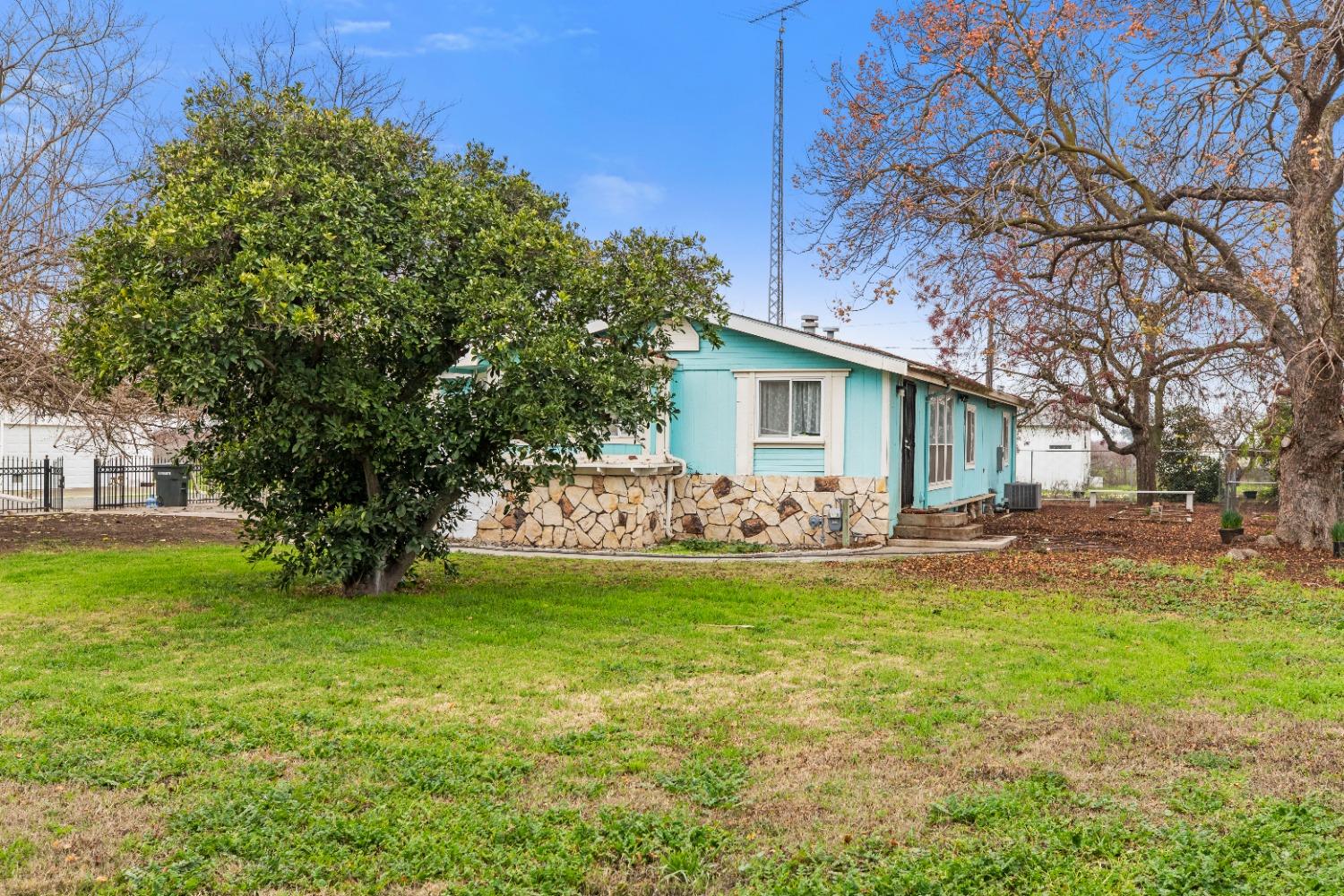5407 Esmar Road Ceres, CA 95307 - Photo 1 of 1 a view of a house with a yard
