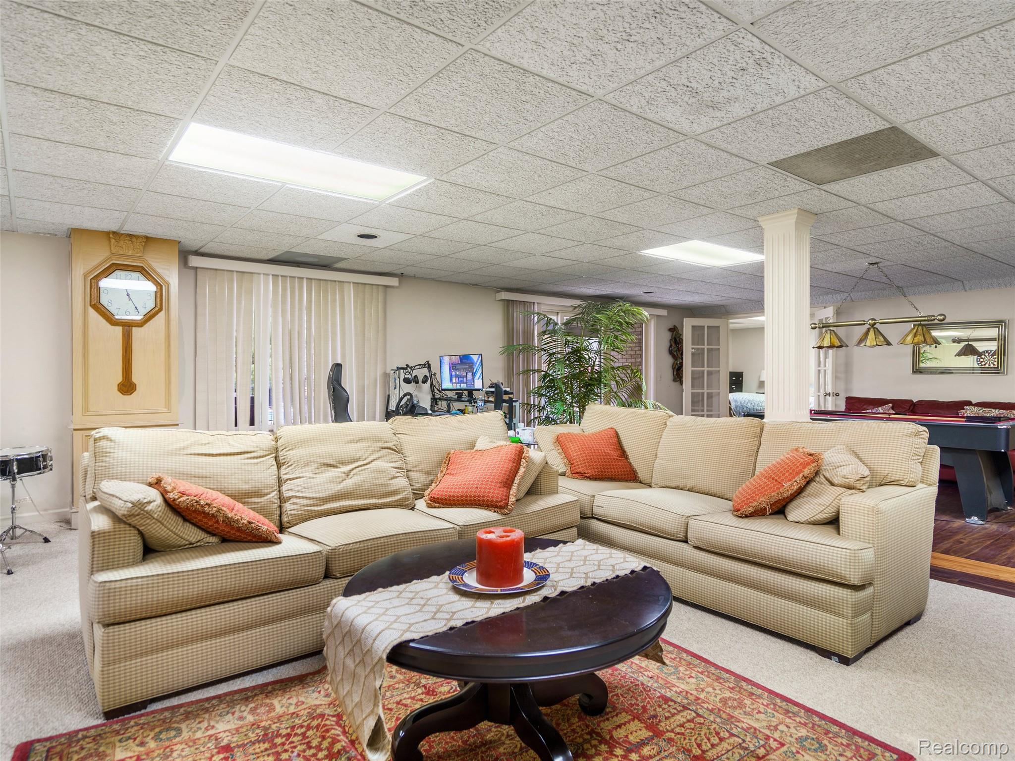 5724 Murfield Drive Rochester, MI 48306 - Photo 98 of 99 Living room featuring carpet flooring and a drop ceiling