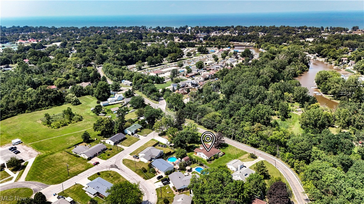 1140 West River Road Vermilion, OH 44089 - Photo 46 of 49 Aerial view of residential area with a large body of water