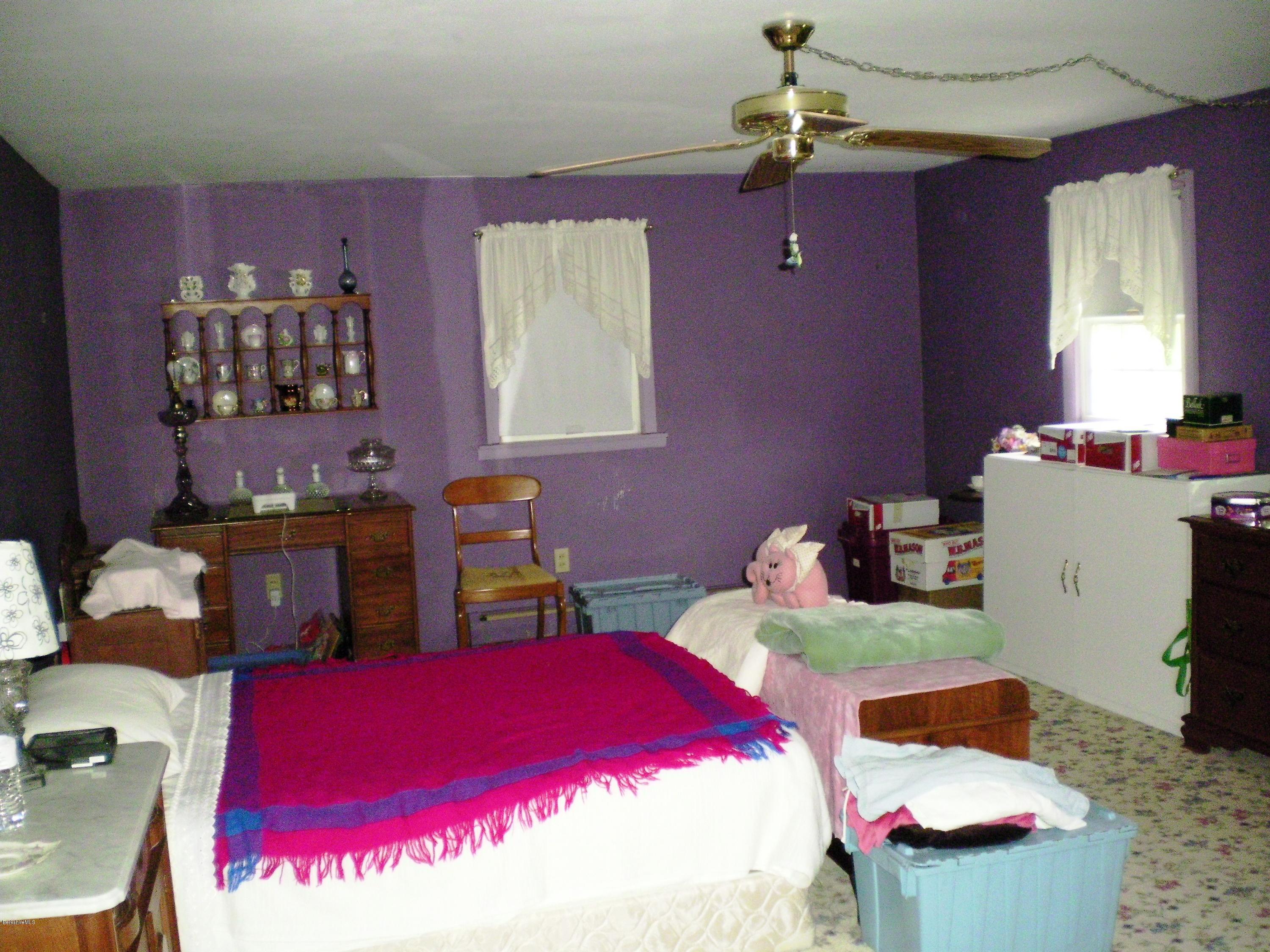 18 West Main Road Peru, MA 01235 - Photo 15 of 23 a bedroom with furniture and a chandelier