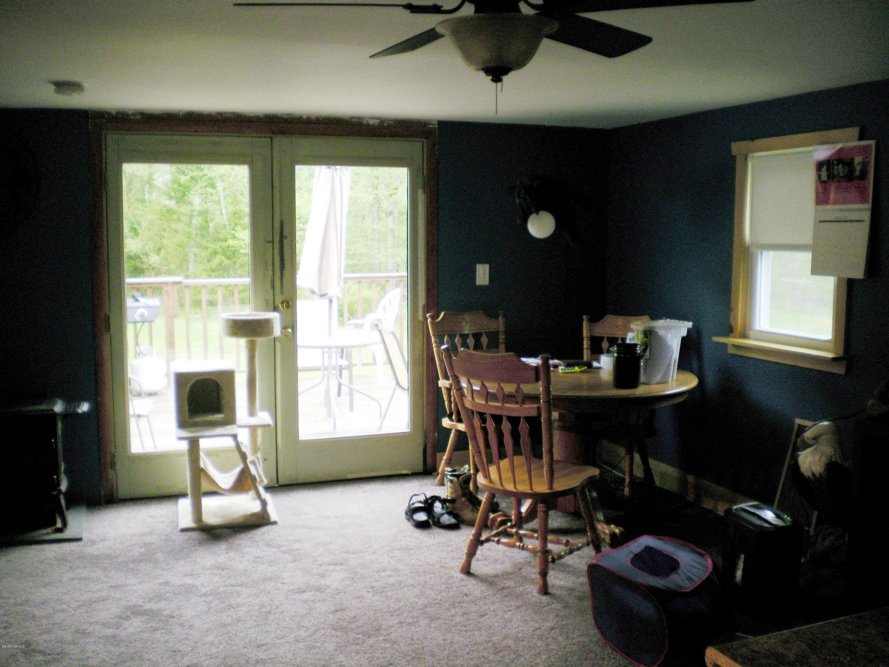 18 West Main Road Peru, MA 01235 - Photo 17 of 23 a living room with furniture and a flat screen tv