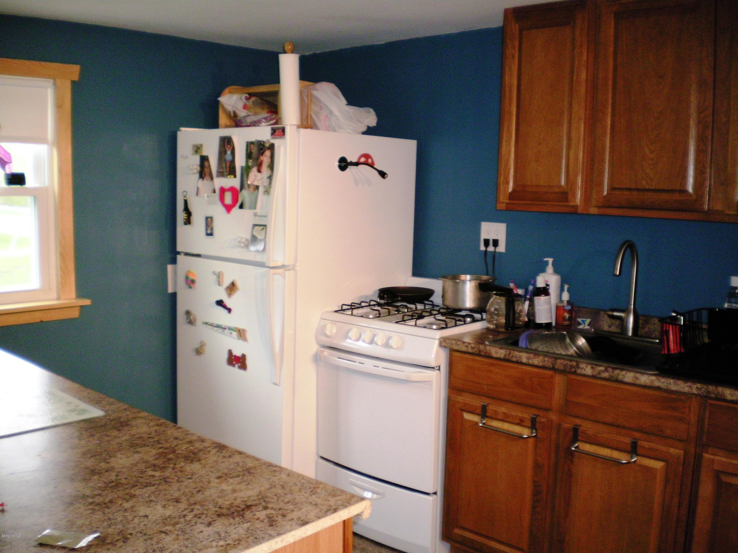 18 West Main Road Peru, MA 01235 - Photo 19 of 23 a kitchen with a stove and a refrigerator