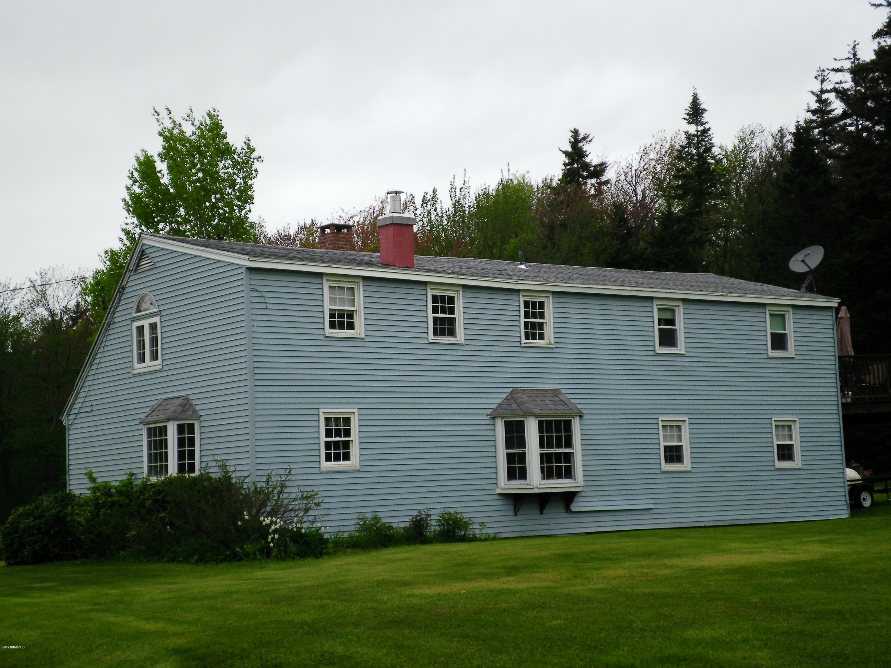 18 West Main Road Peru, MA 01235 - Photo 3 of 23 a front view of house with yard and green space