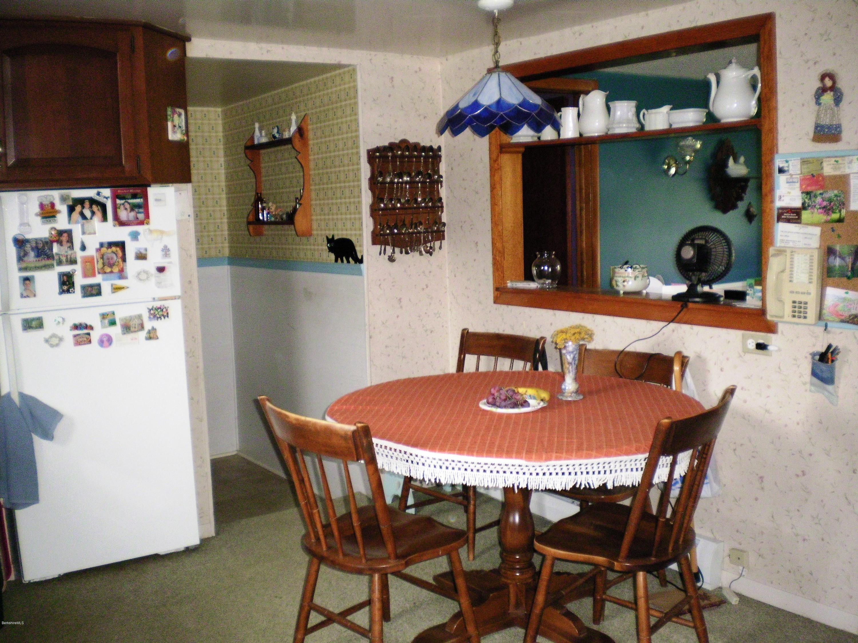 18 West Main Road Peru, MA 01235 - Photo 10 of 23 a dining room with furniture and wooden floor