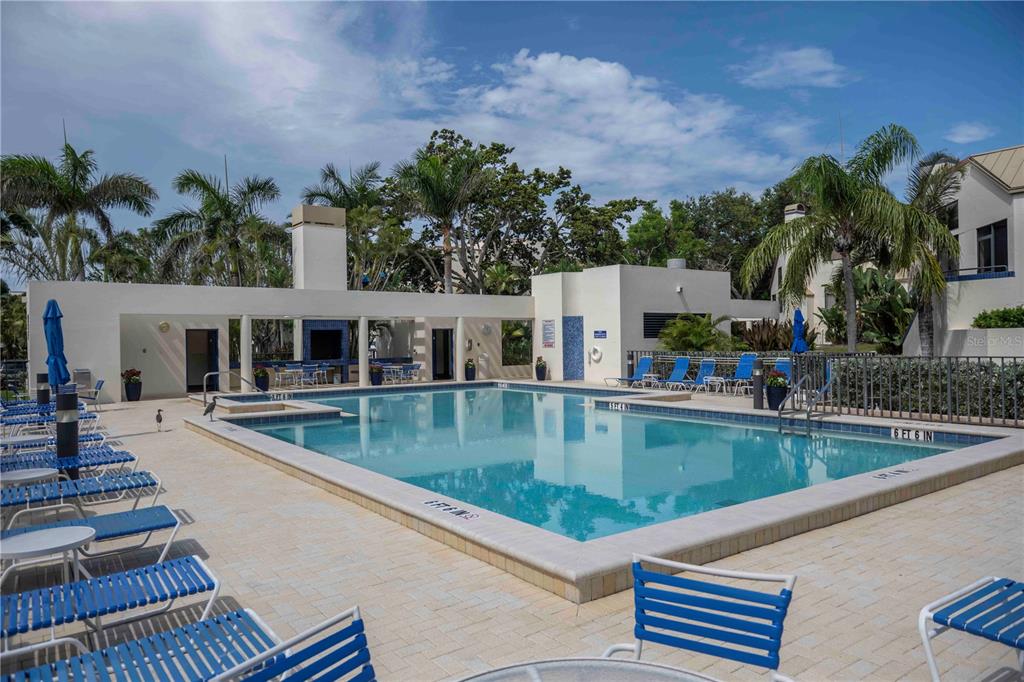 1922 Harbourside Drive, Unit 1102 Longboat Key, FL 34228 - Photo 19 of 23 swimming pool view with outdoor seating