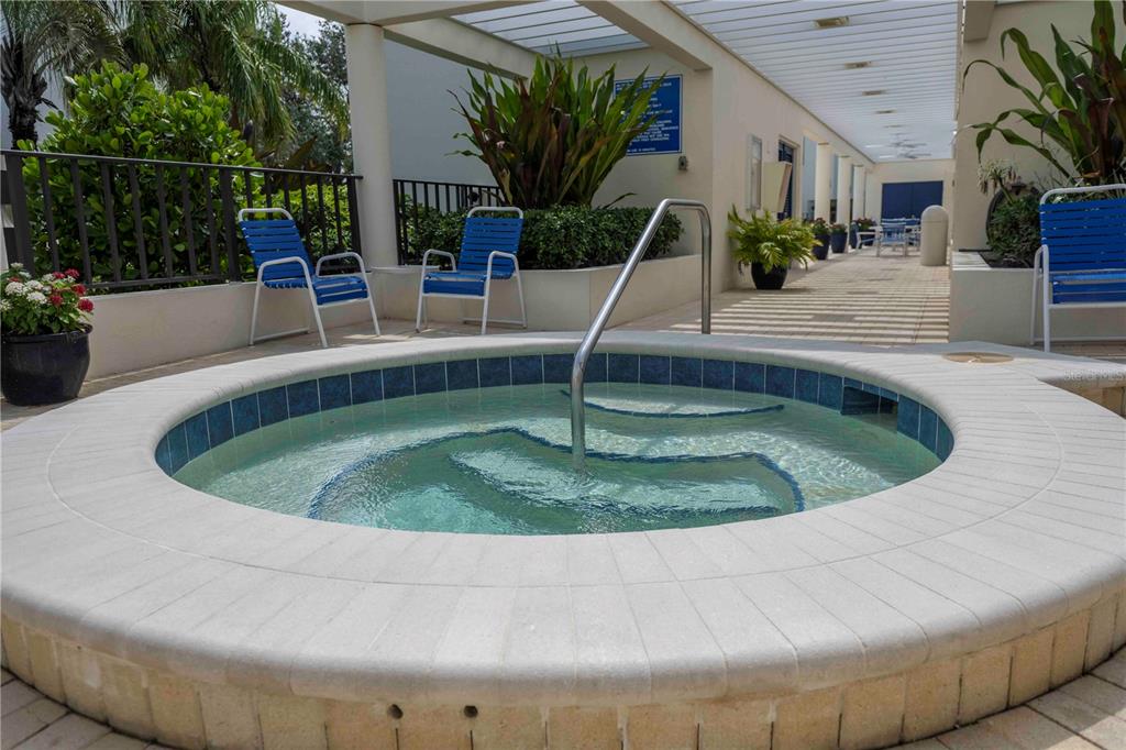 1922 Harbourside Drive, Unit 1102 Longboat Key, FL 34228 - Photo 23 of 23 a white tub sitting in a bathroom