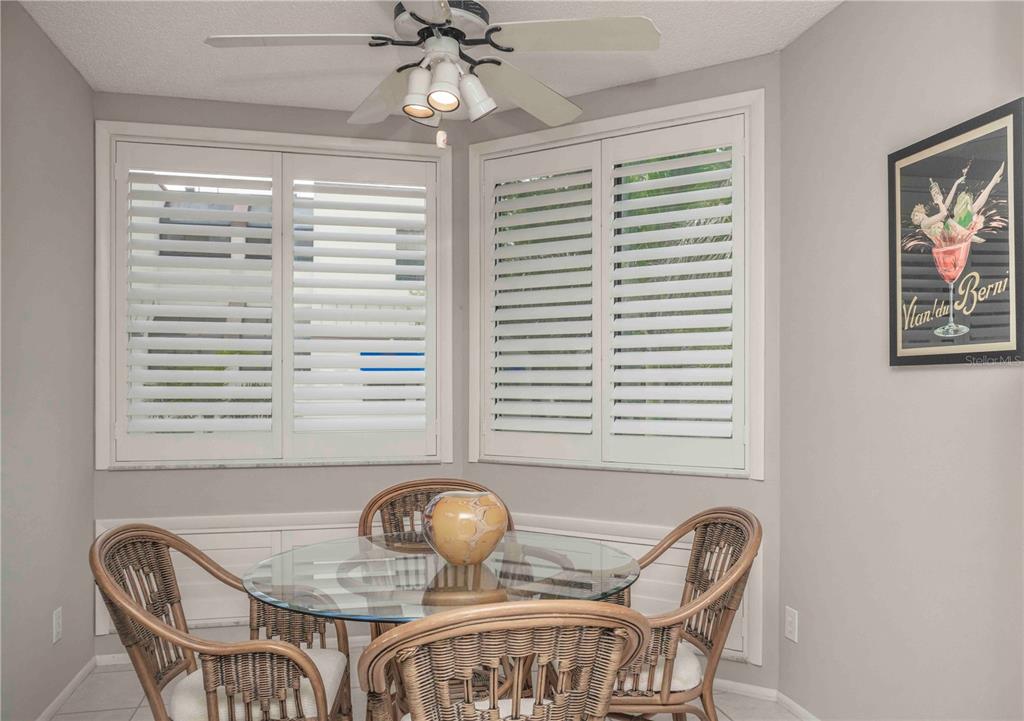 1922 Harbourside Drive, Unit 1102 Longboat Key, FL 34228 - Photo 4 of 23 a dining room with furniture and window