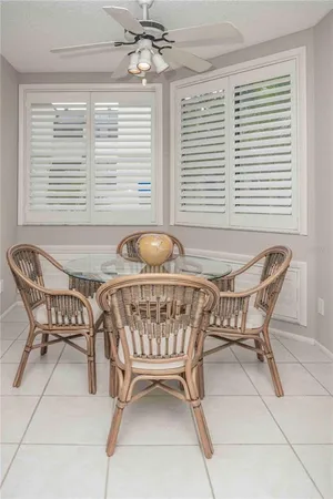 a dining room with furniture and window