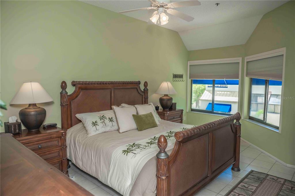 1922 Harbourside Drive, Unit 1102 Longboat Key, FL 34228 - Photo 10 of 23 a bedroom with a bed and window
