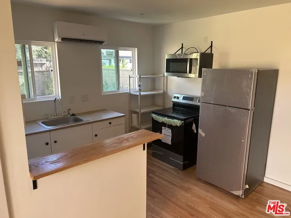 a close view of a utility room with dryer and washer
