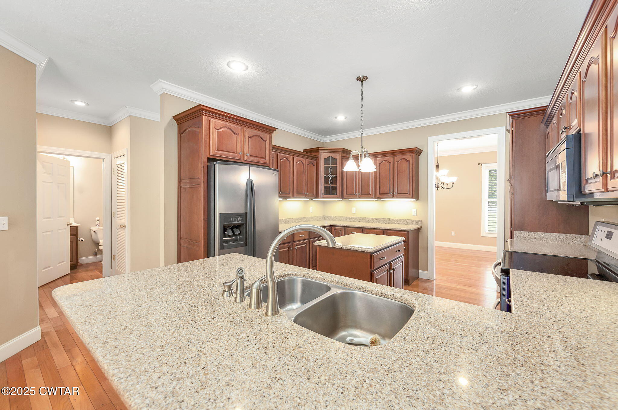 495 Sycamore Lane McKenzie, TN 38201 - Photo 12 of 21 a kitchen with stainless steel appliances granite countertop a sink a refrigerator and a granite counter tops